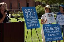 Vape-free schools event with posters that say 95% of tobacco users begin use before the age of 21, Colorado leads the nation in vaping use, and lungs are meant for oxygen.