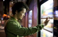 Man buying items from a vending machine