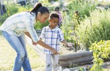 Woman and child looking at raised beds