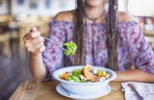 A woman eating a salad