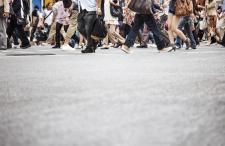 Pedestrians crossing a street in a crosswalk