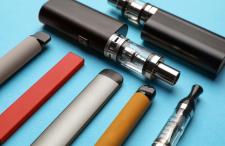 Several e-cigarette varieties on a blue background