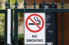 No smoking sign on a condo building gate