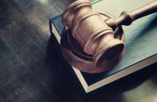 a gavel placed on top of a book