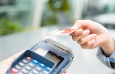 A person using a credit card machine