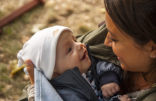 Mother holding a smiling baby