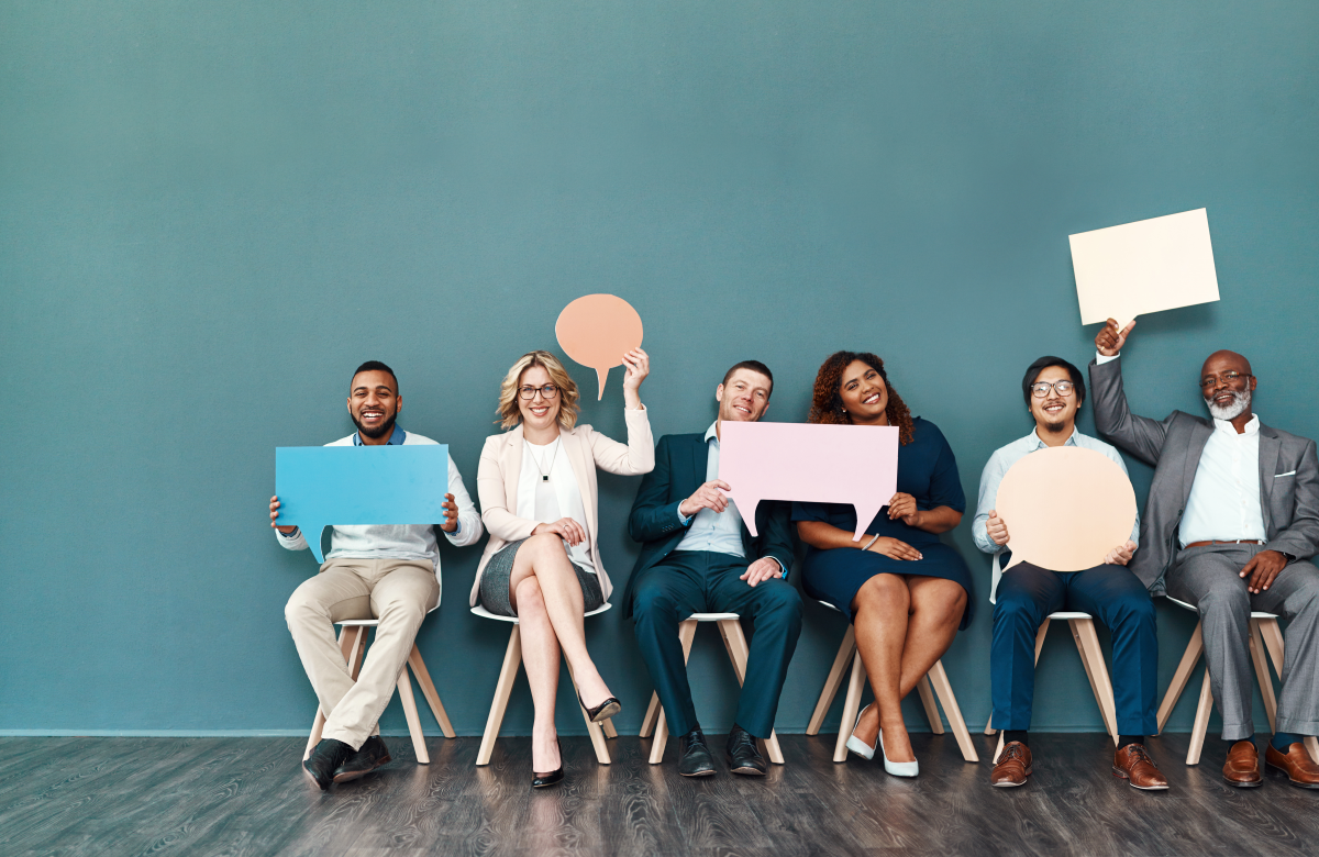 A group of people holding thought bubbles