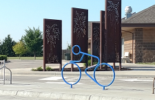 Metal sculpture of cyclist